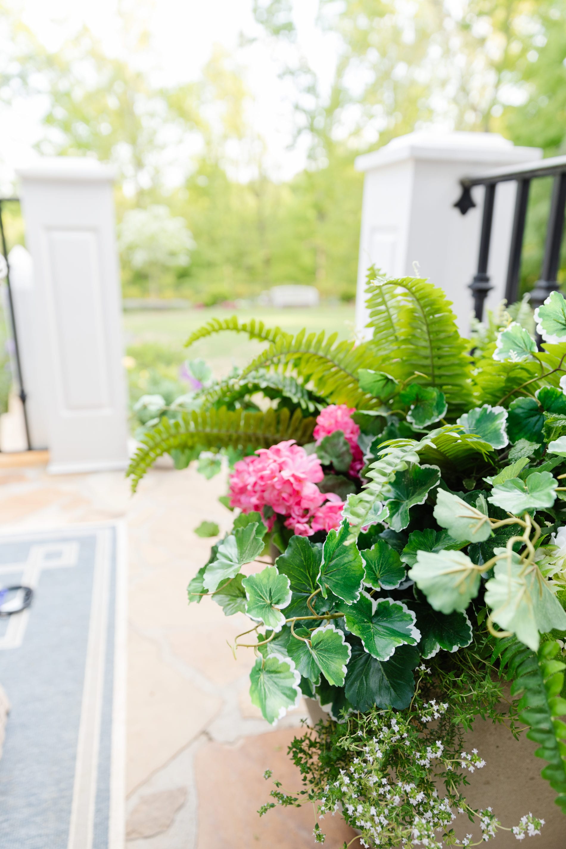 I put fake flowers outside. But can you tell? I dare you! bluegraygal